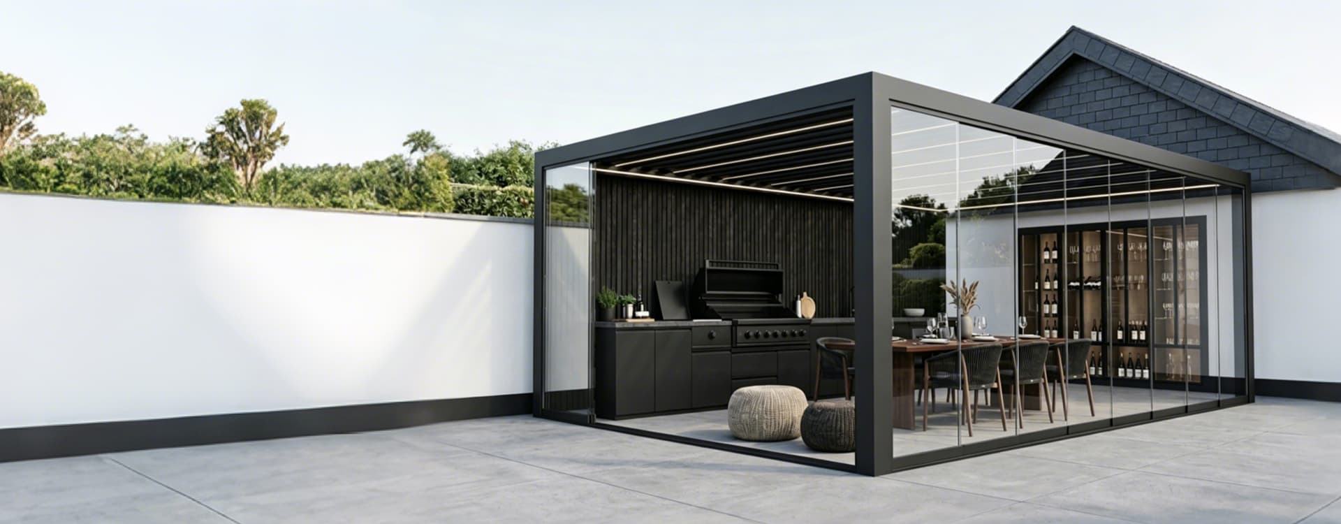 Custom aluminum pergola with glass doors and outdoor kitchen for a modern outdoor living project